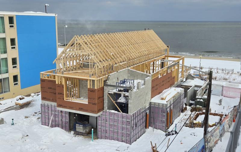 Just a few days after the storm passed, but with snow still on the ground, the roof trusses are installed.